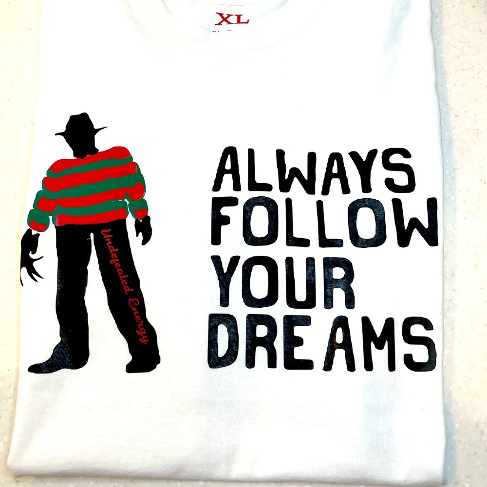 FOLLOW YOUR DREAMS TEE BY : Undefeated Energy